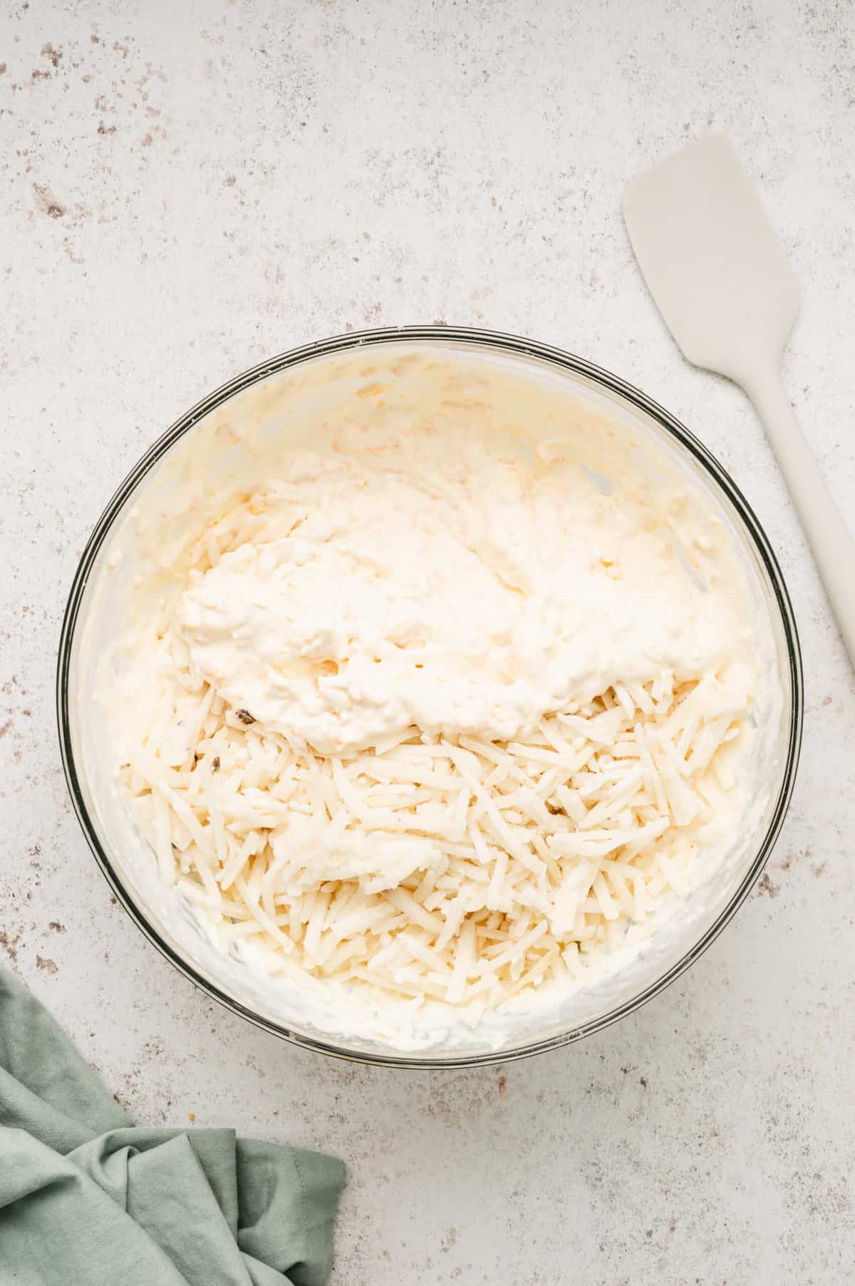 Combined ingredients for Cheesy Hashbrown Potatoes
in mixing bowl