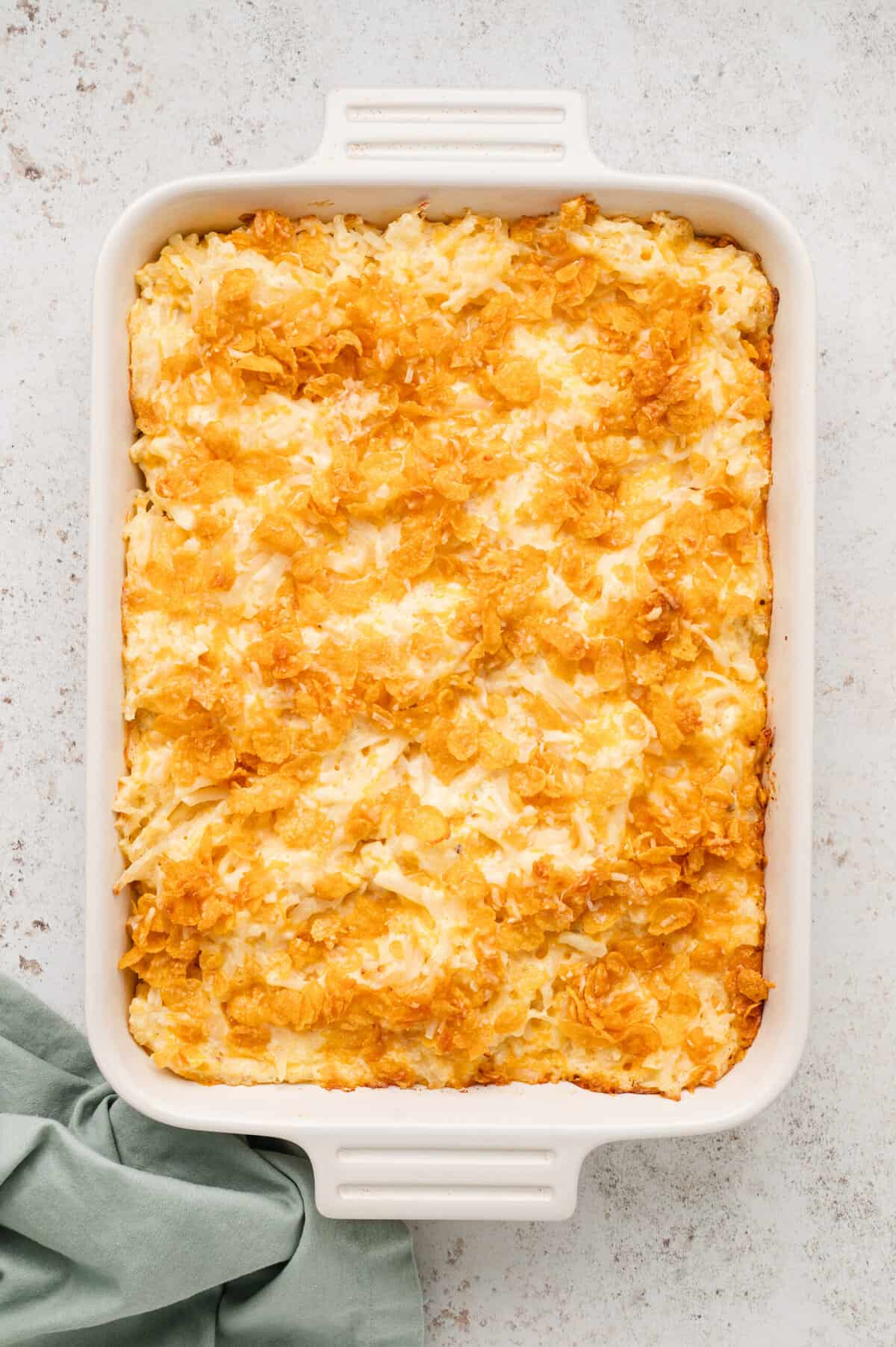 Cheesy Potatoes recipe hot out of the oven in a baking dish