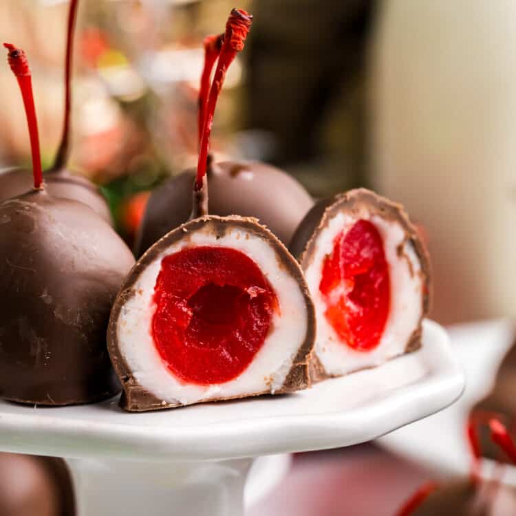 Chocolate Covered Cherries on pedestal serving platter cut open