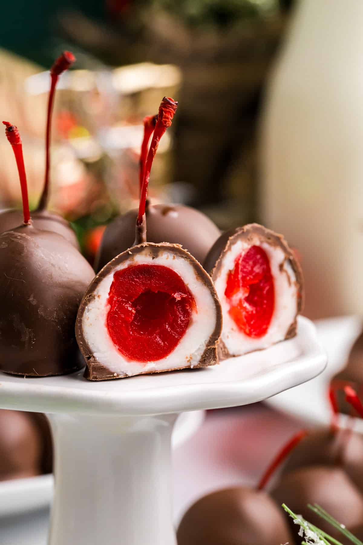 Chocolate Covered Cherries on pedestal serving platter cut open