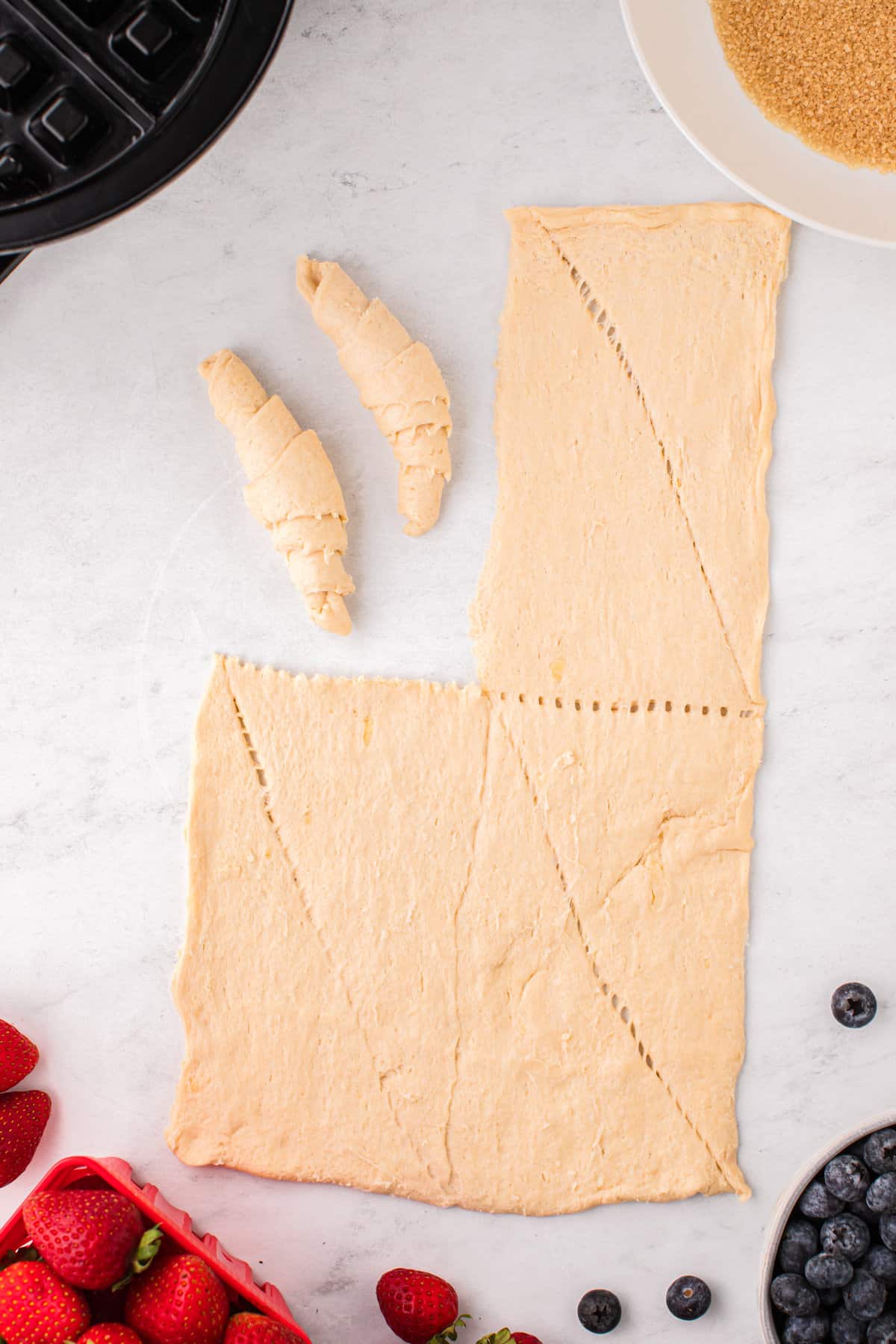 Pull apart on the perforated triangles and roll them from the larger end to the smaller end.