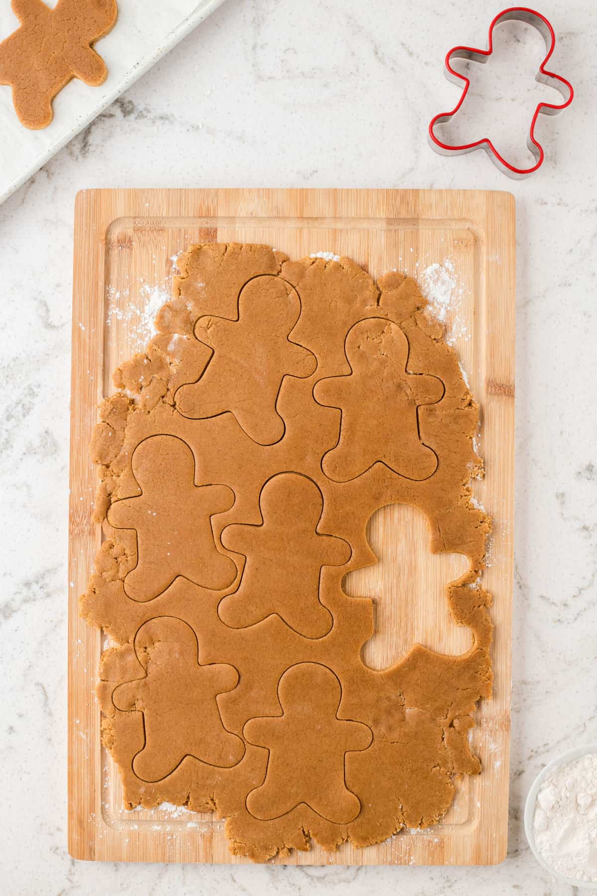 Use the Gingerbread Cookie Cutter to make gingerbread man shapes in the rolled out dough.