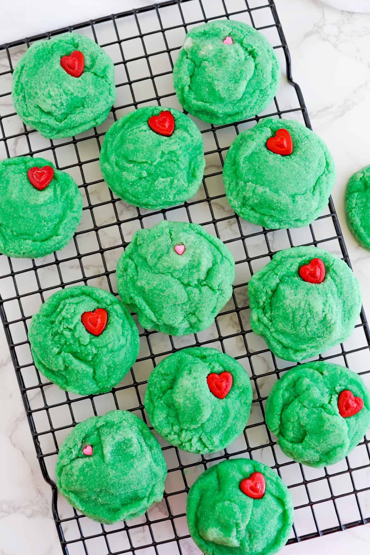 Cookies cooling with a heart stuck in each cookie. Can be any shape/size of heart.