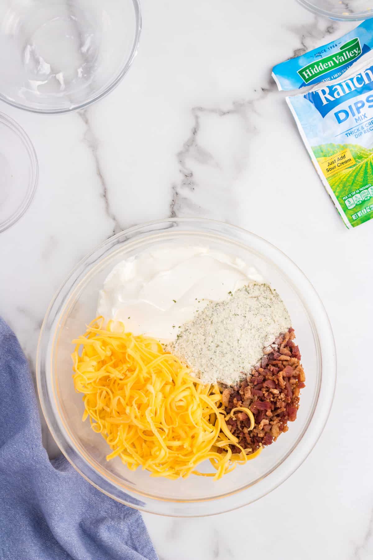 Crack Dip ingredients in glass mixing bowl prior to mixing