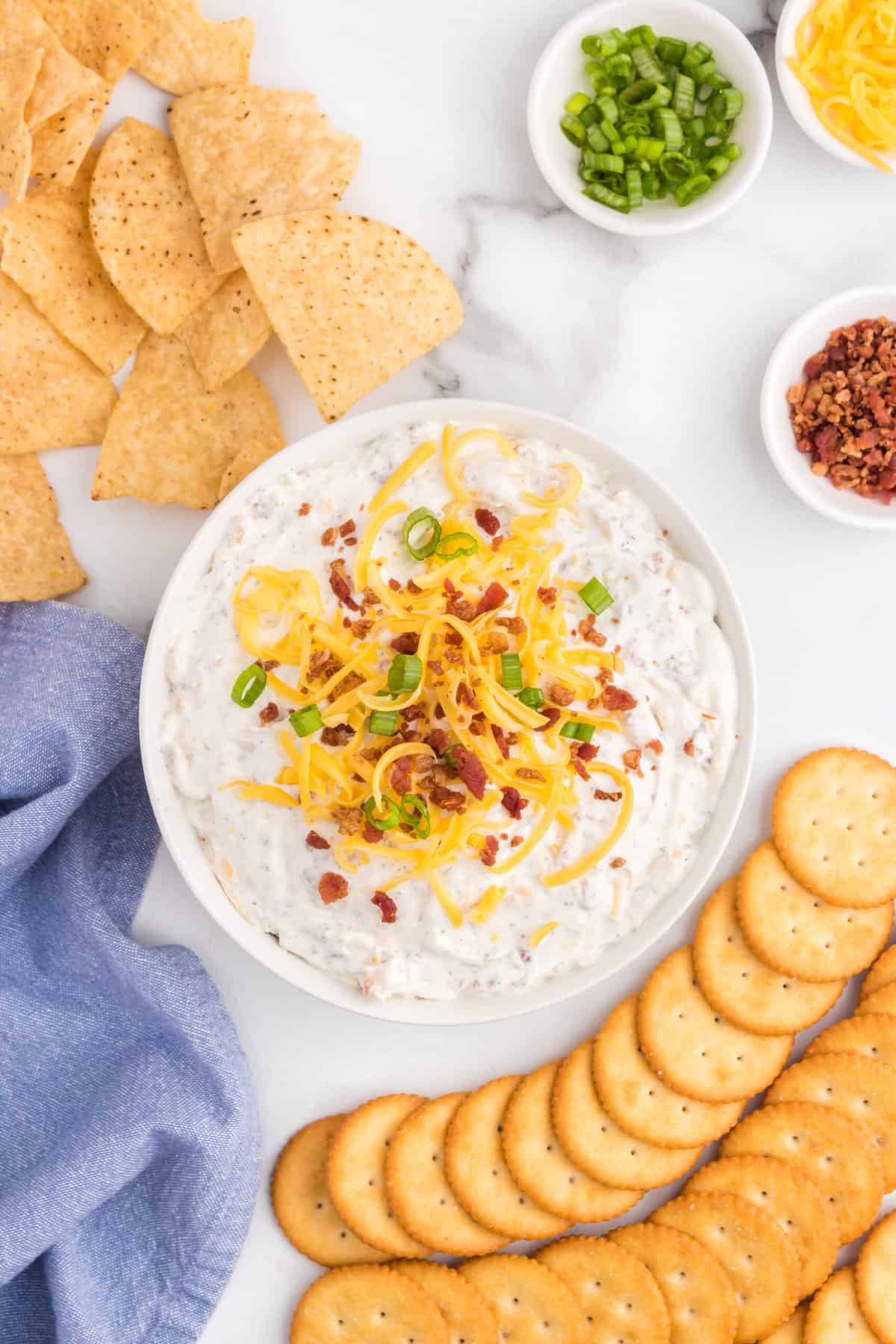 Crack Dip with Fixings in Serving Bowl with Crackers for Dipping