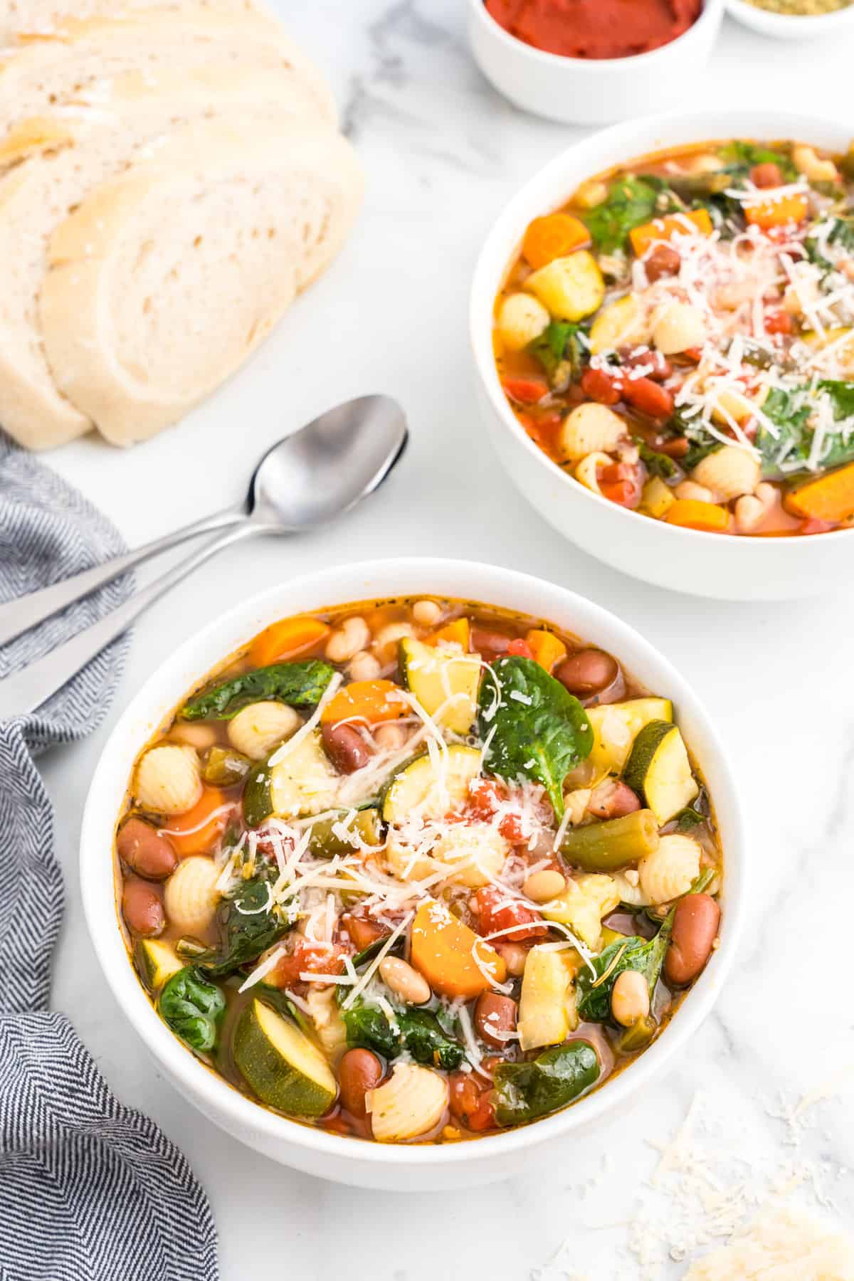 Vegetable Minestrone Soup in serving bowl topped with shredded Parmesan cheese 