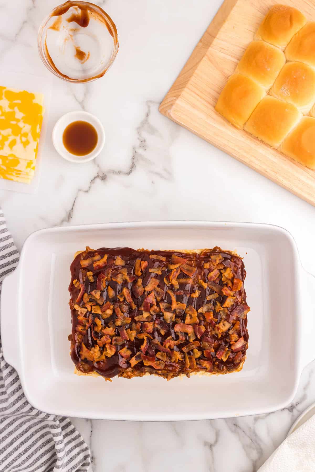 Adding layer of cooked bacon to Pulled Pork Sliders recipe