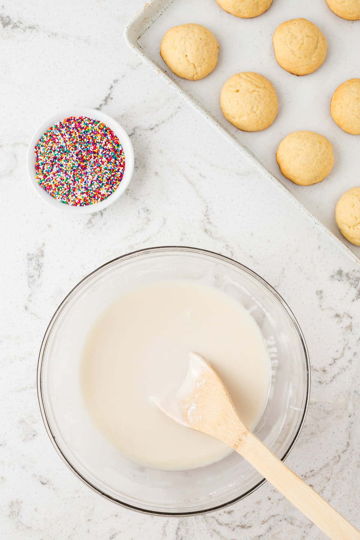 Mix together powdered sugar, milk, lemon juice and vanilla extract in a bowl until thick and creamy.