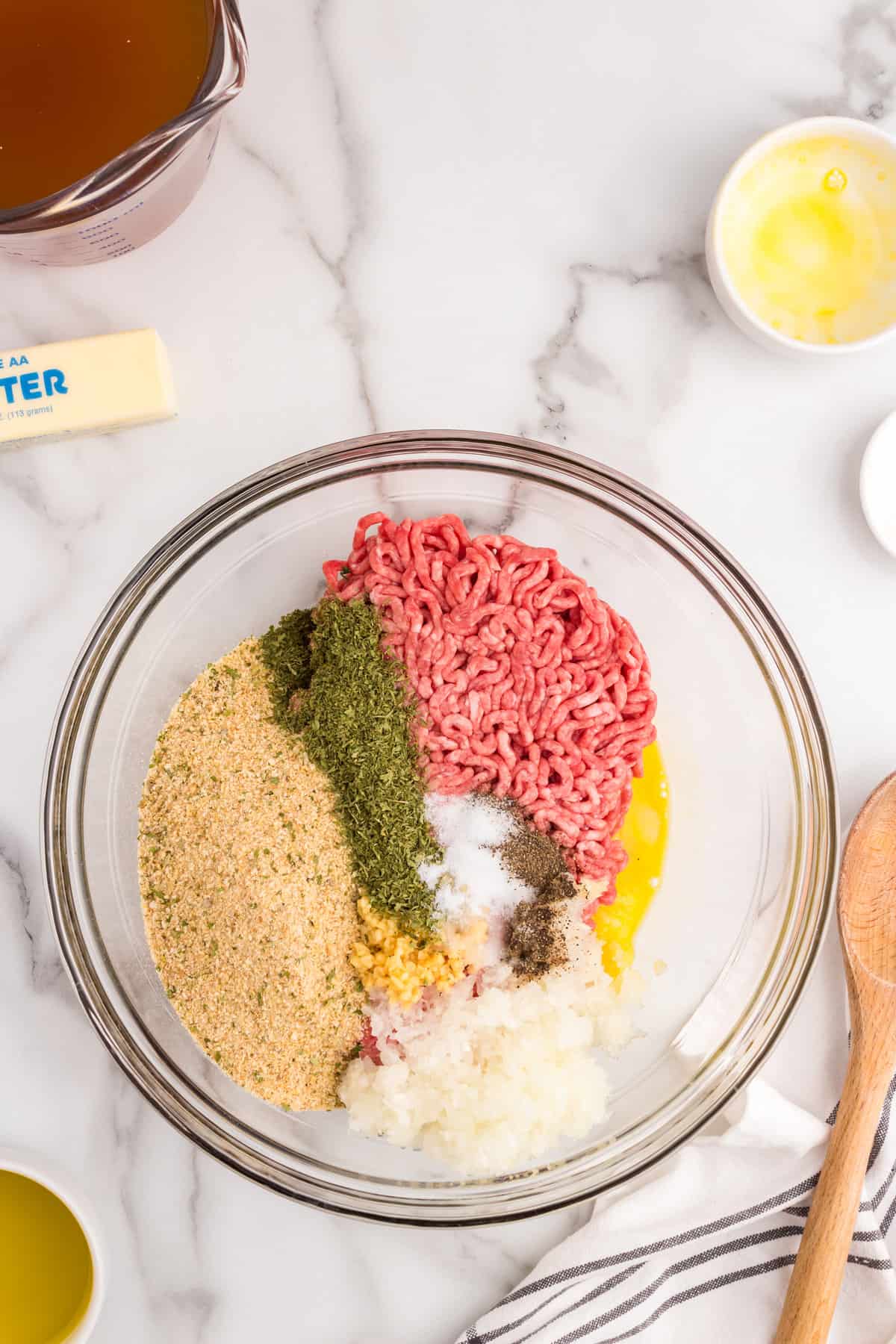 Glass bowl with ingredients to make meatballs