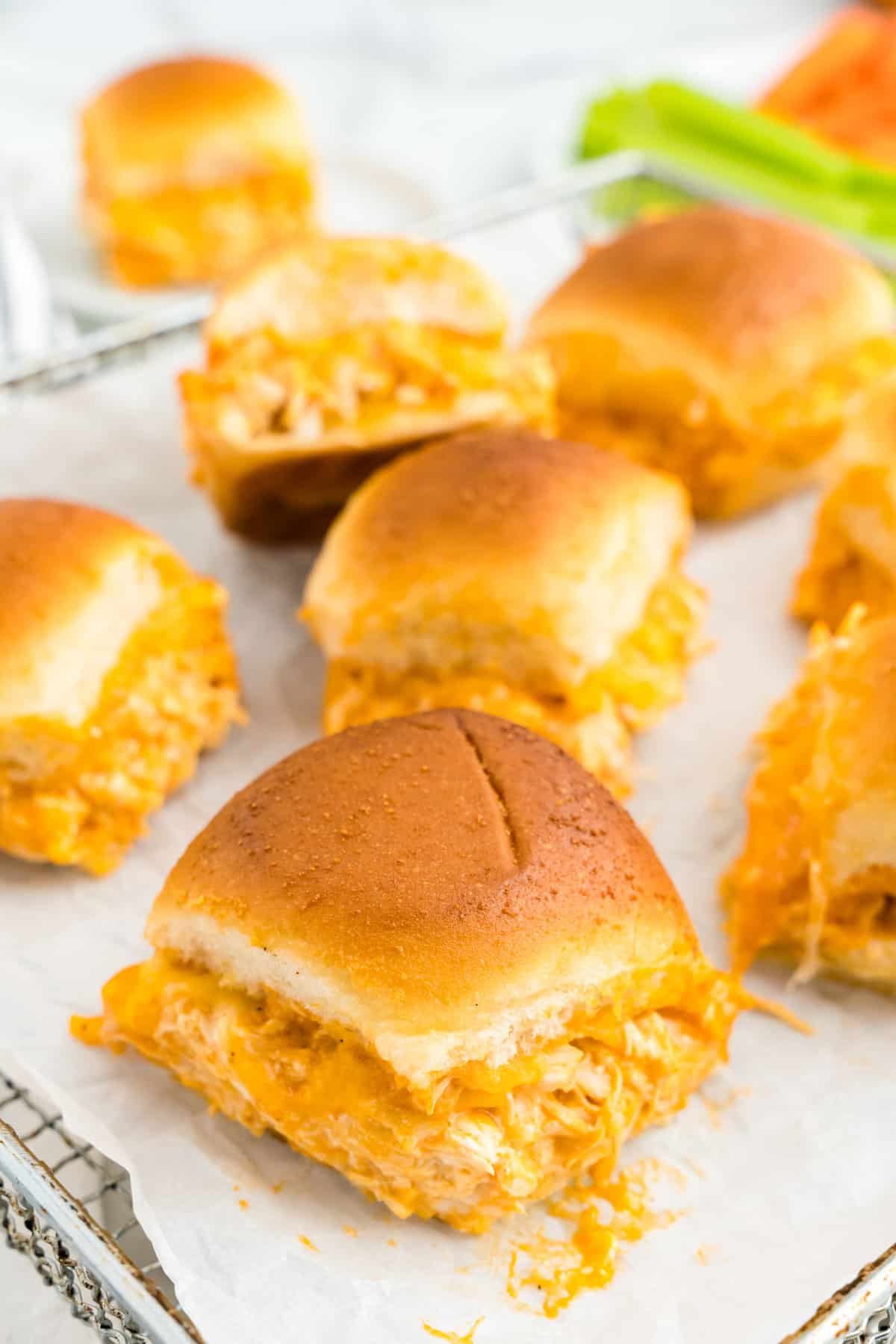 Buffalo Chicken Sliders scattered on serving plate