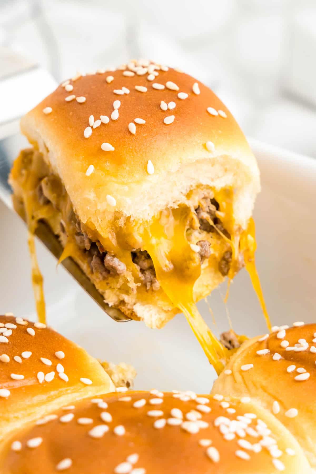 Cheeseburger sliders with hawaiian rolls in baking dish