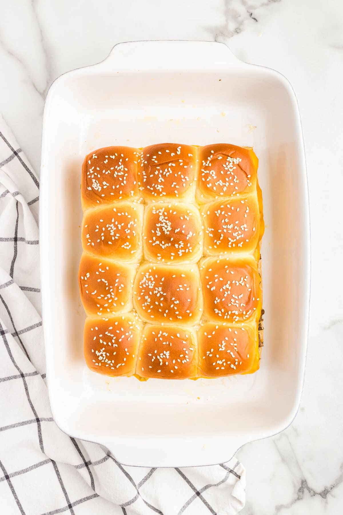 Cheeseburger Sliders baked to a golden brown in baking dish