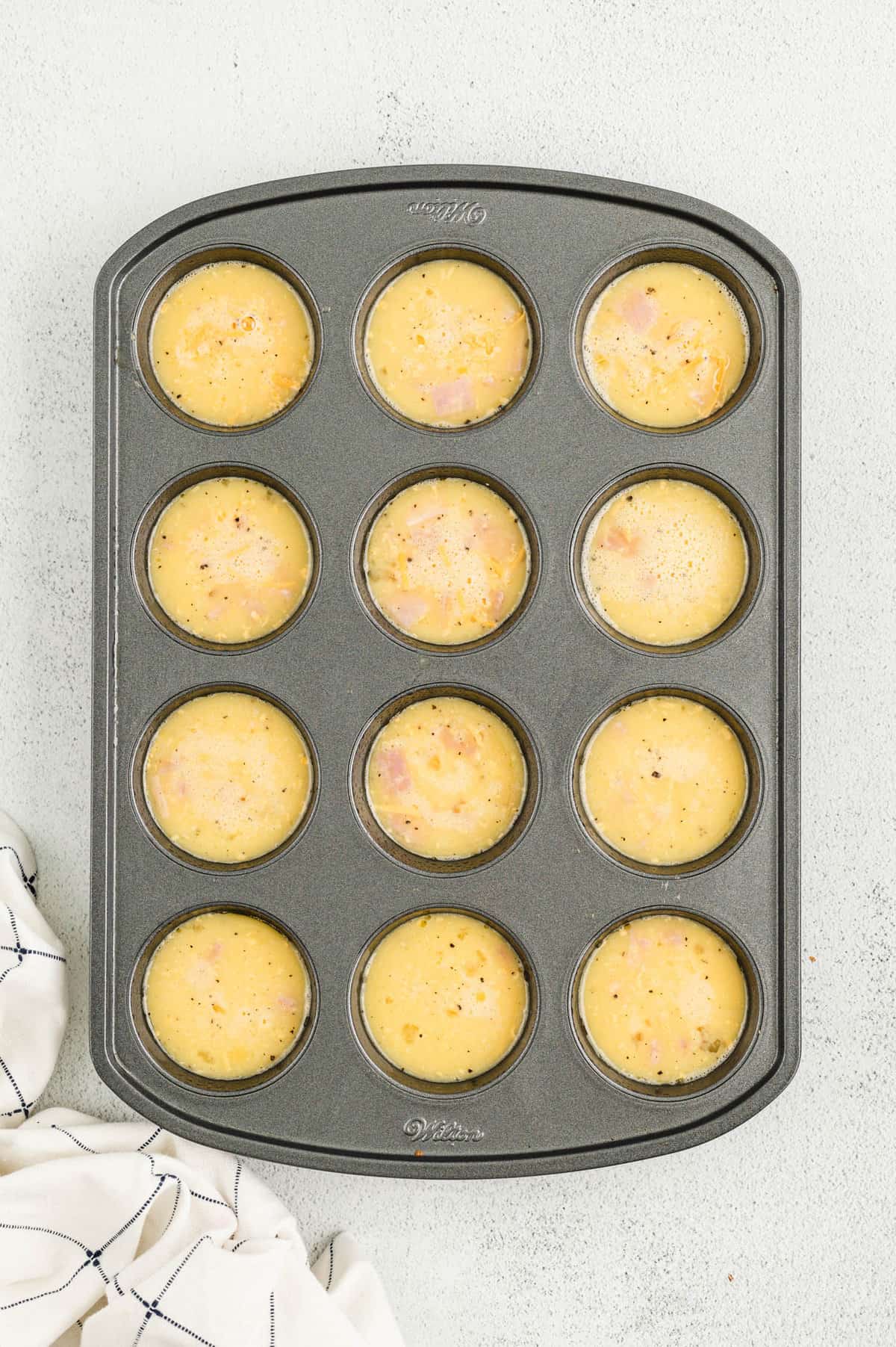 Egg mixture in muffin tin for Egg Muffin Cups