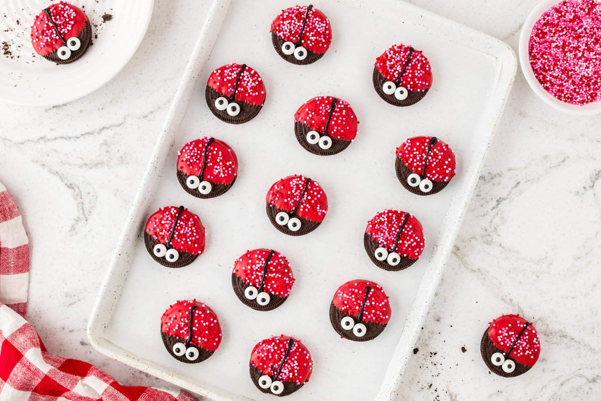 Ladybug Oreos on cookie sheet hardening