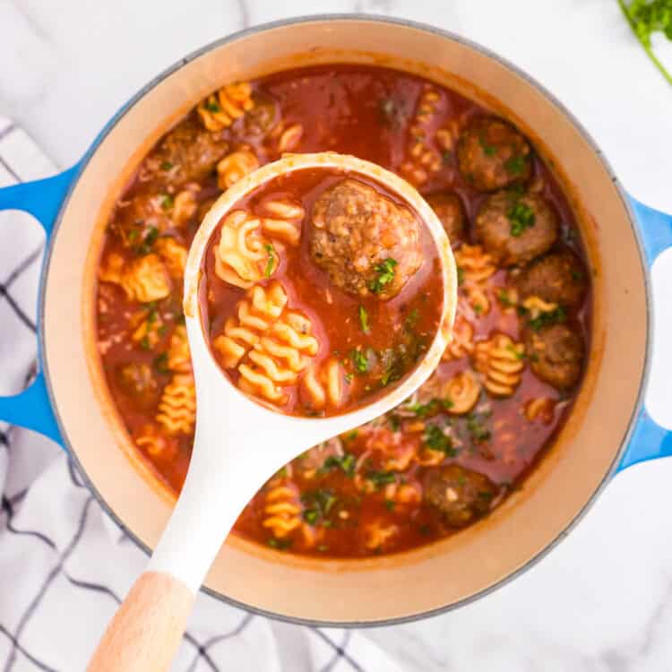 Meatball Soup in stovetop pot with scoop