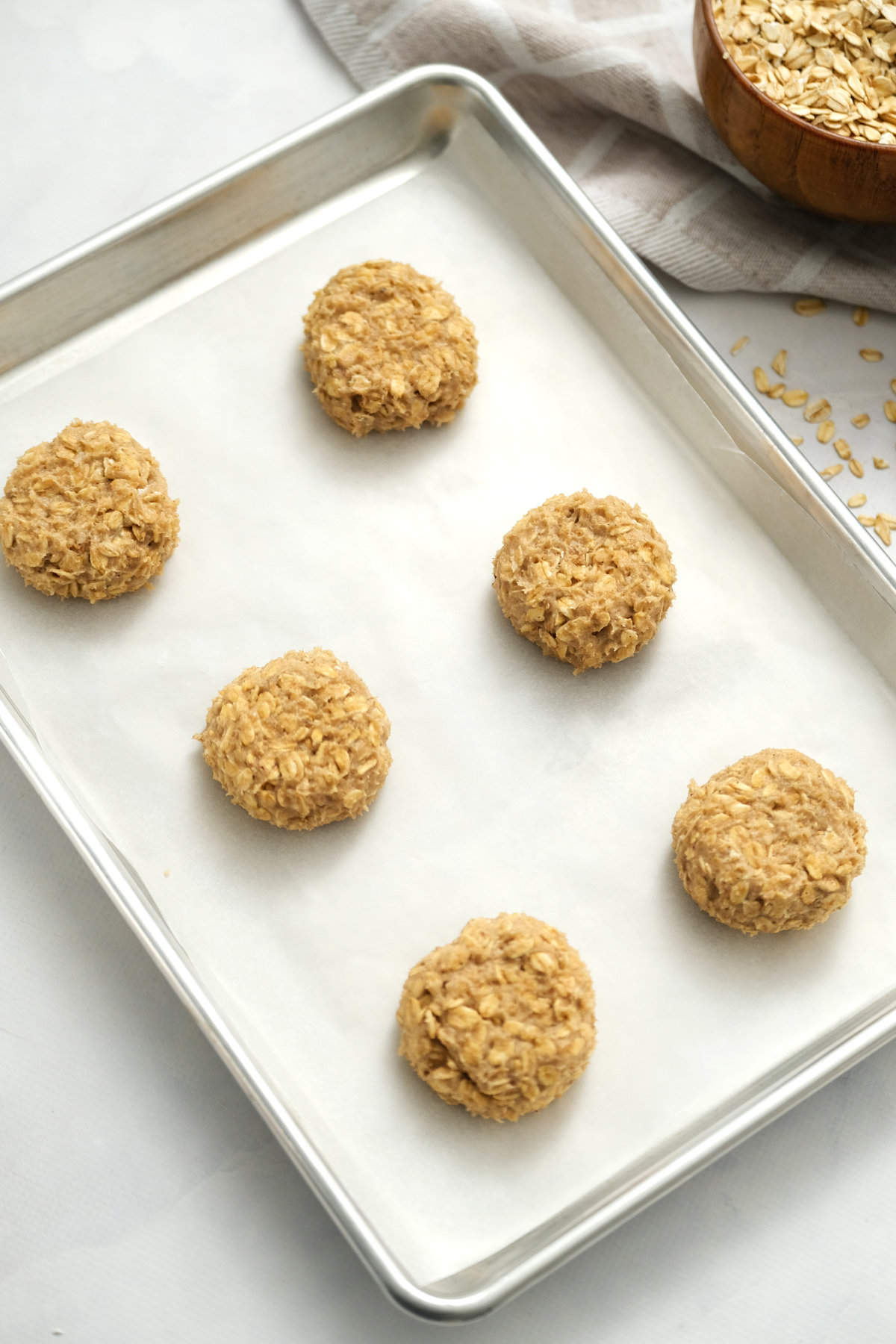 Sheet pan with oatmeal cookies before baking