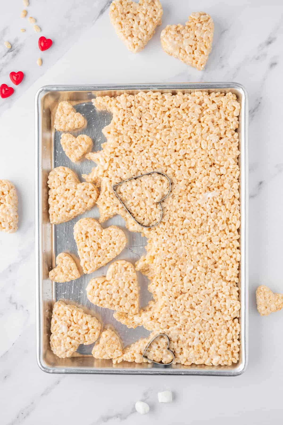 Using a heart shaped Cookie Cutter, cut apart the rice Krispies.