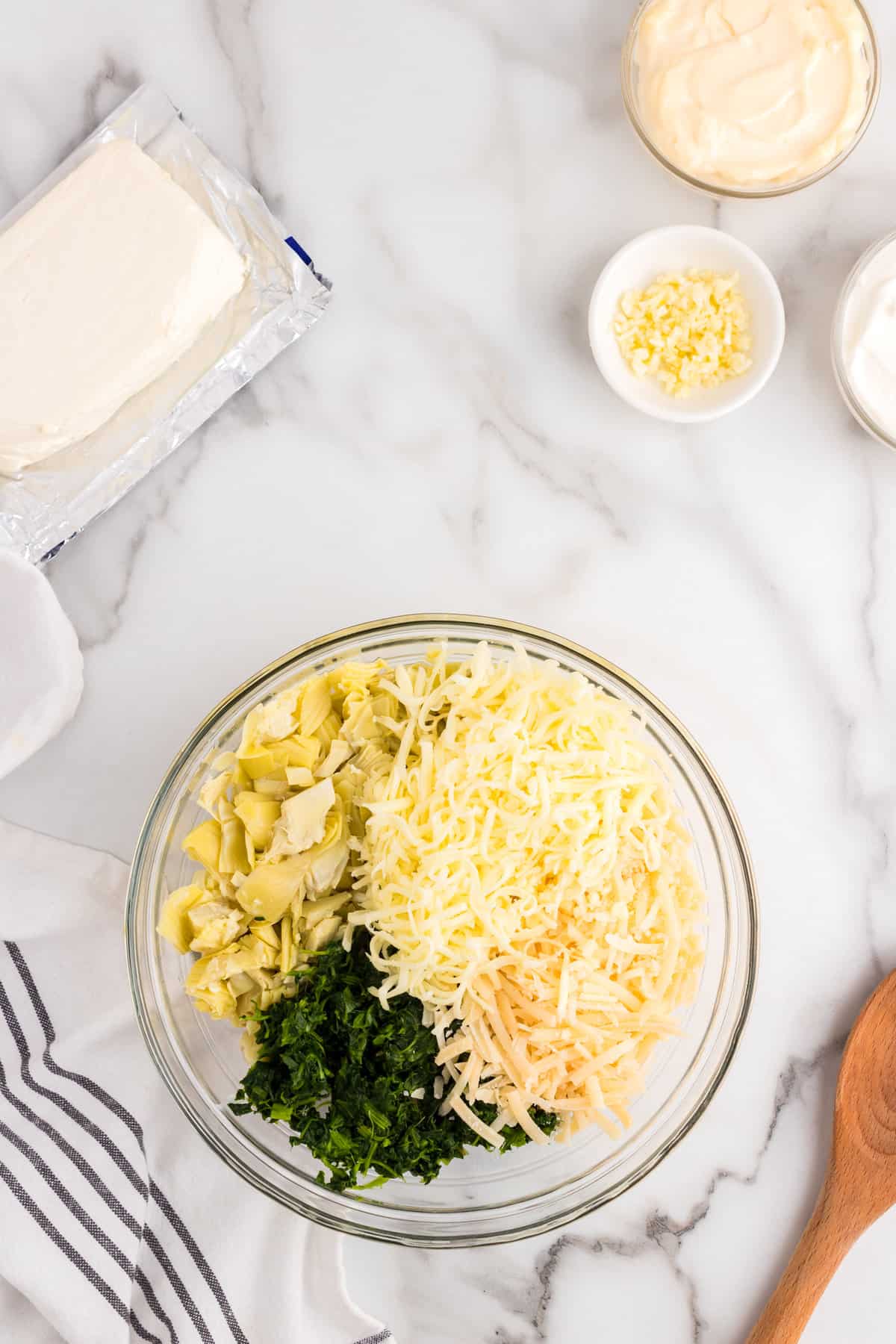 Ingredients in mixing bowl for Spinach Artichoke Dip