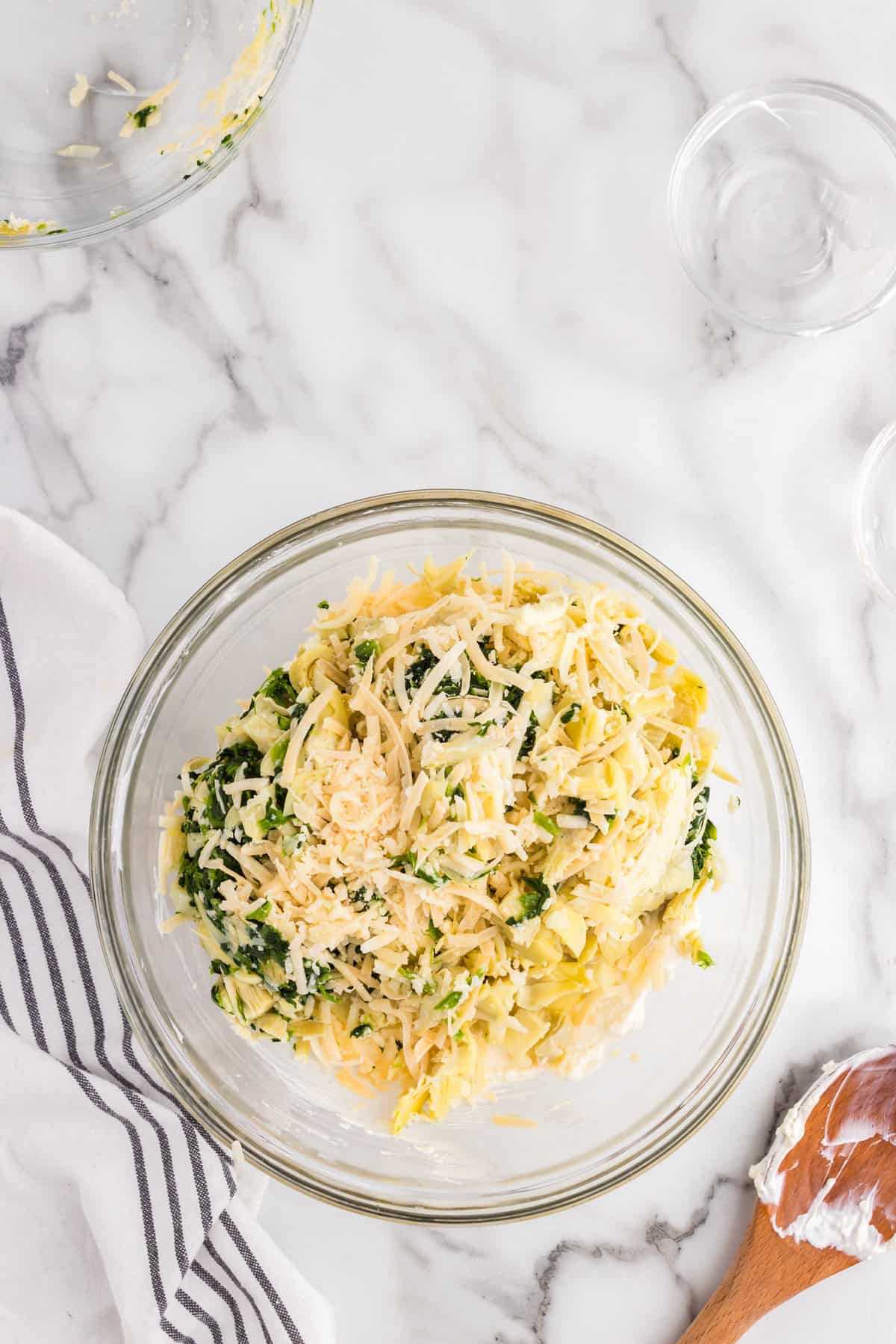 Combined Spinach Artichoke Dip ingredients in mixing bowl