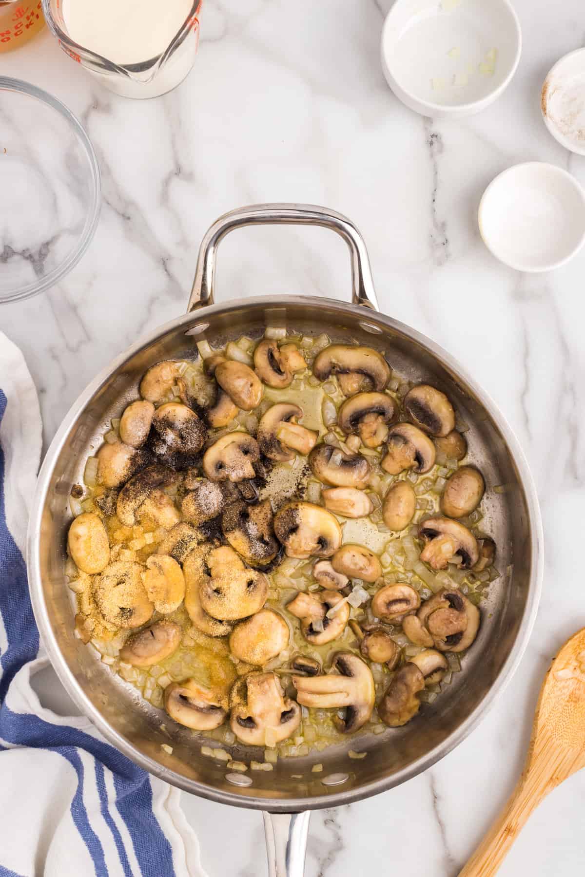 Cooked mushrooms and onions for Chicken ala King recipe in stovetop skillet