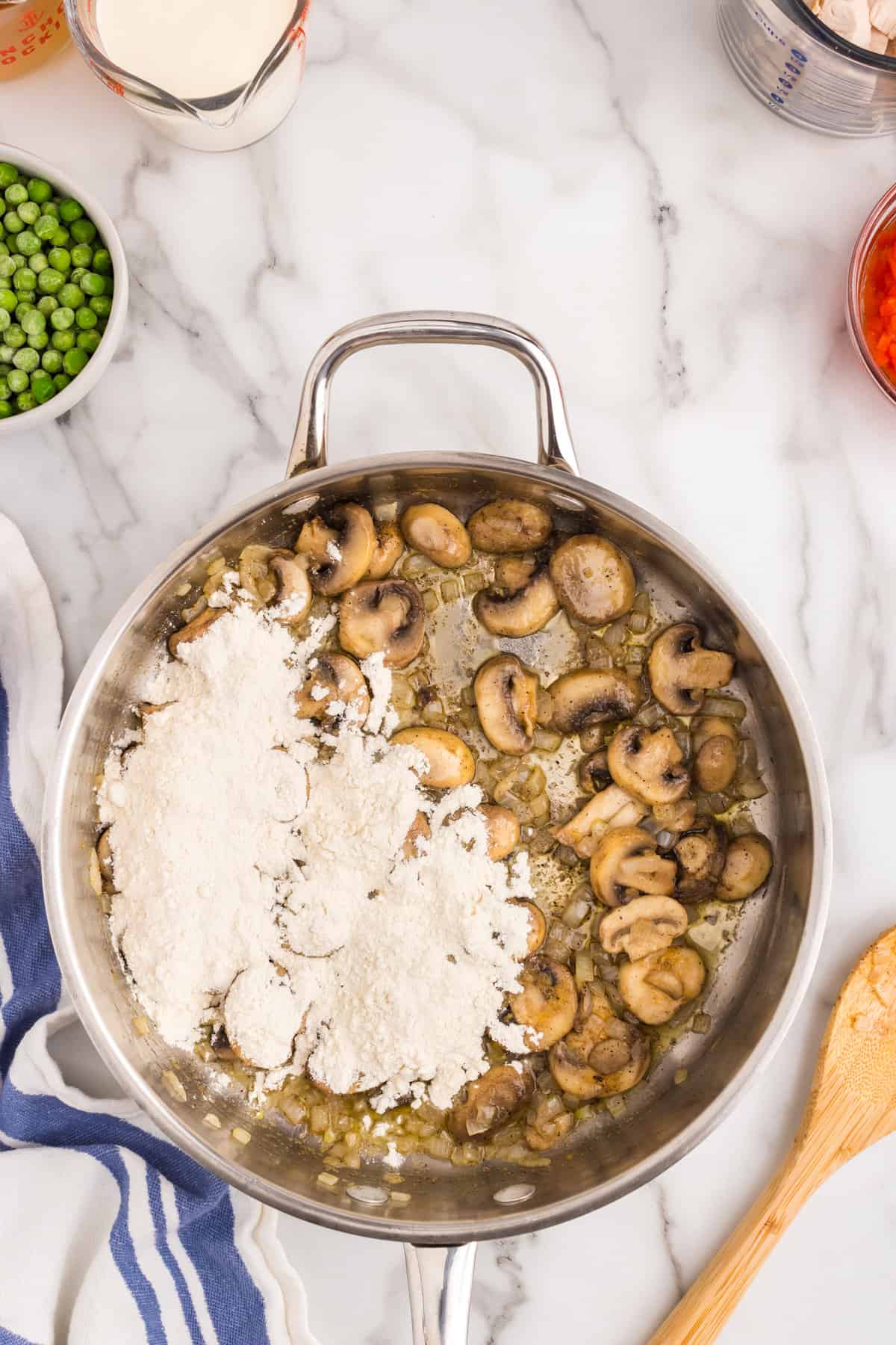 Adding flour to mixture in skillet for Chicken ala King recipe