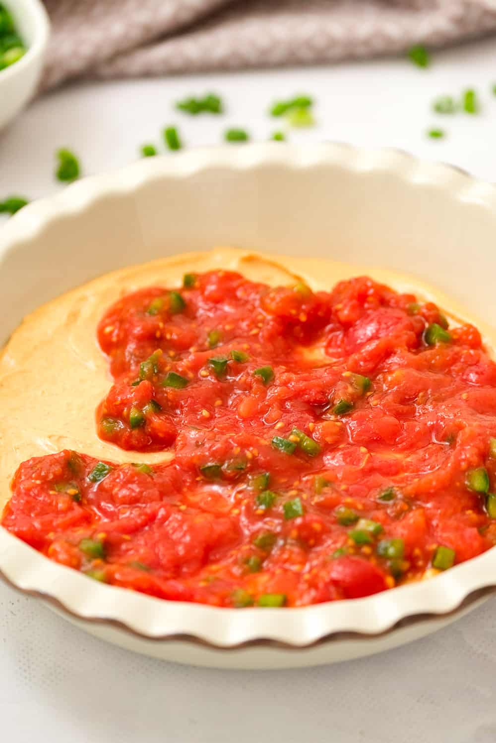 Salsa layered on cream cheese layer for taco dip