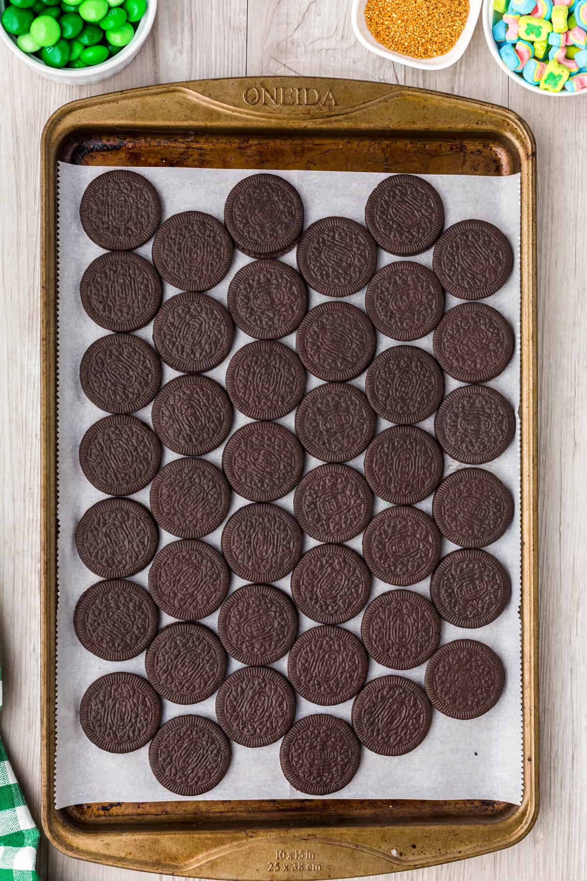 Line a baking sheet with parchment paper & line oreos up in a single layer.