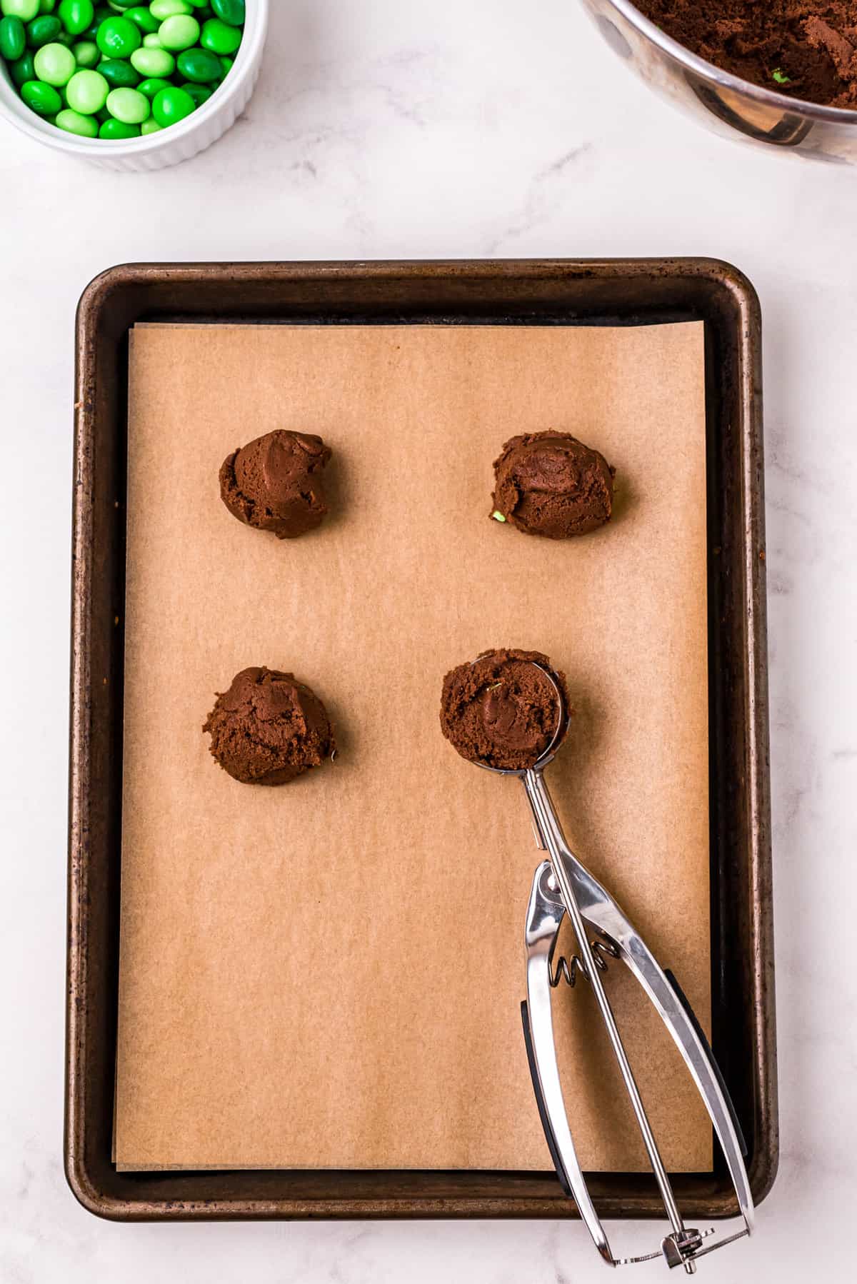 Form 1 tablespoon size balls and place them onto at baking sheet lined with parchment paper.