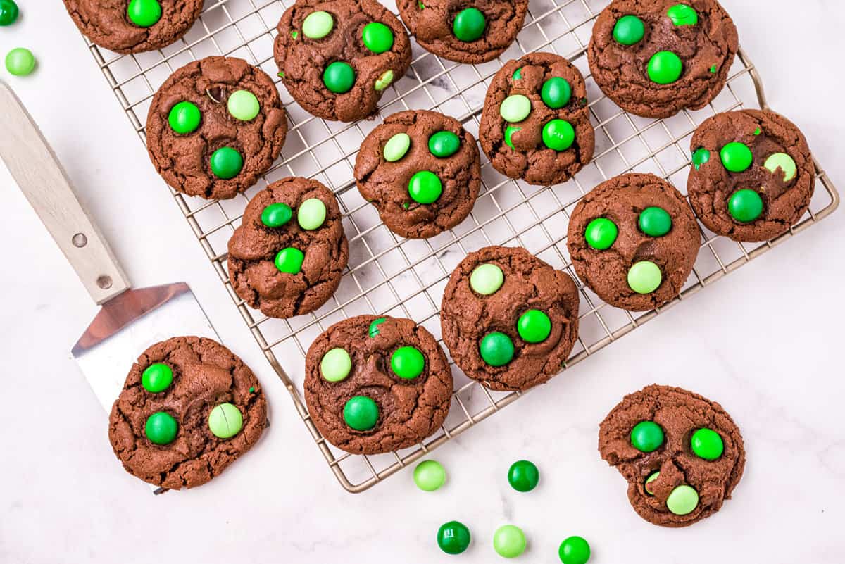 Cookies sitting on a cooling rack.