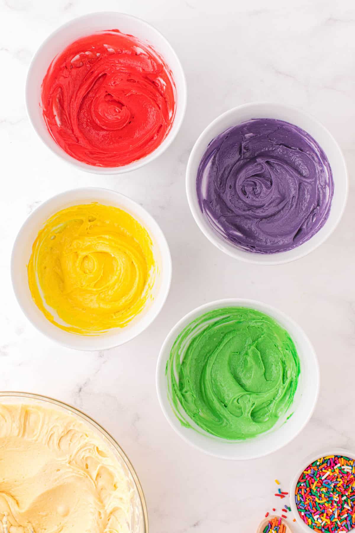 Add food coloring to the individual bowls.