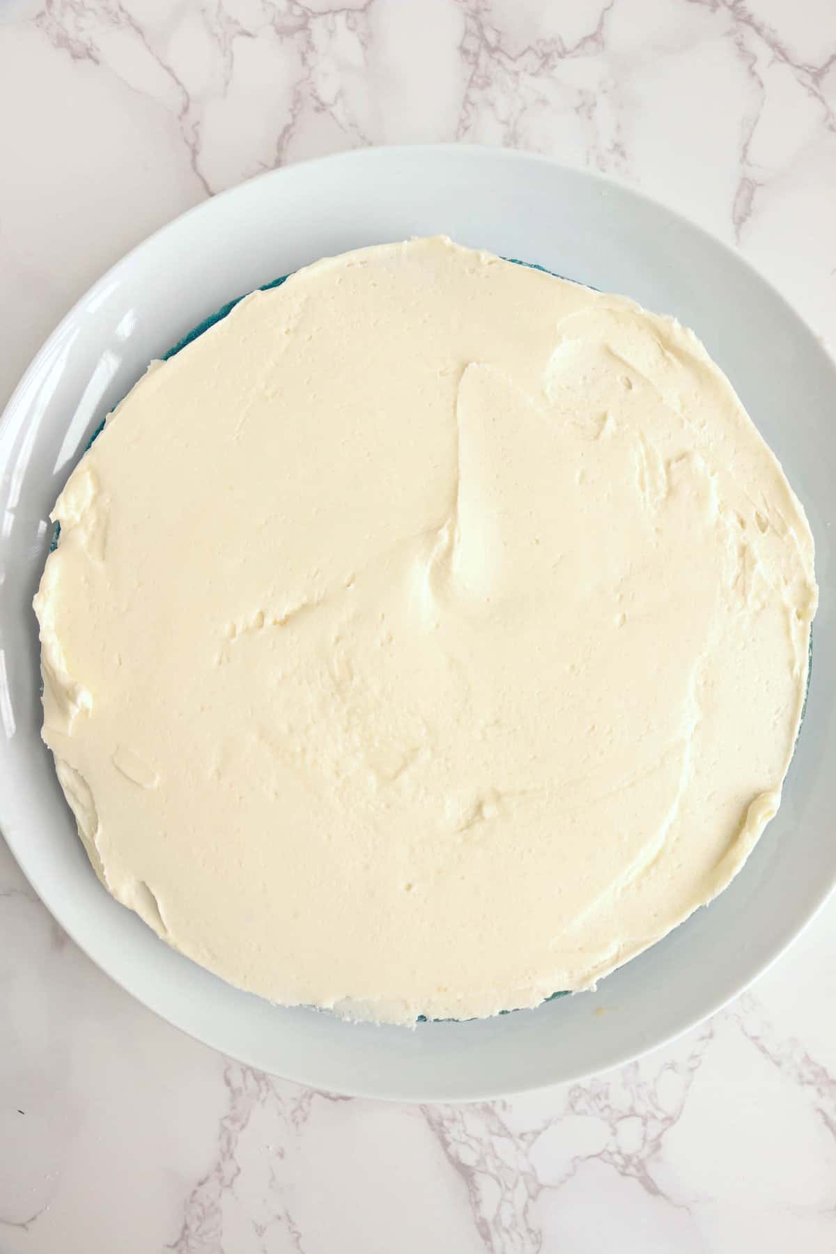 Add frosting to each layer of cake.