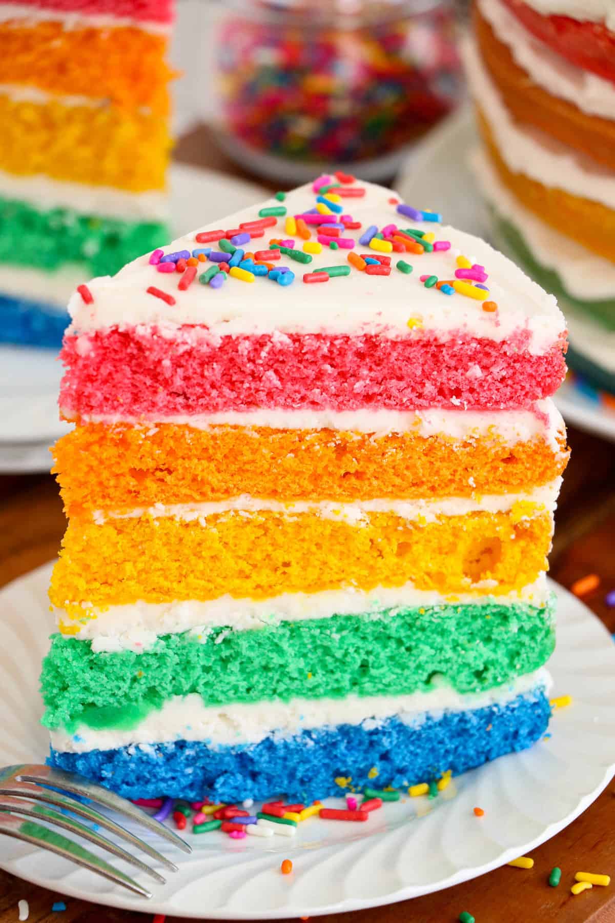 A slice of cake sitting on a white plate, ready to be served.