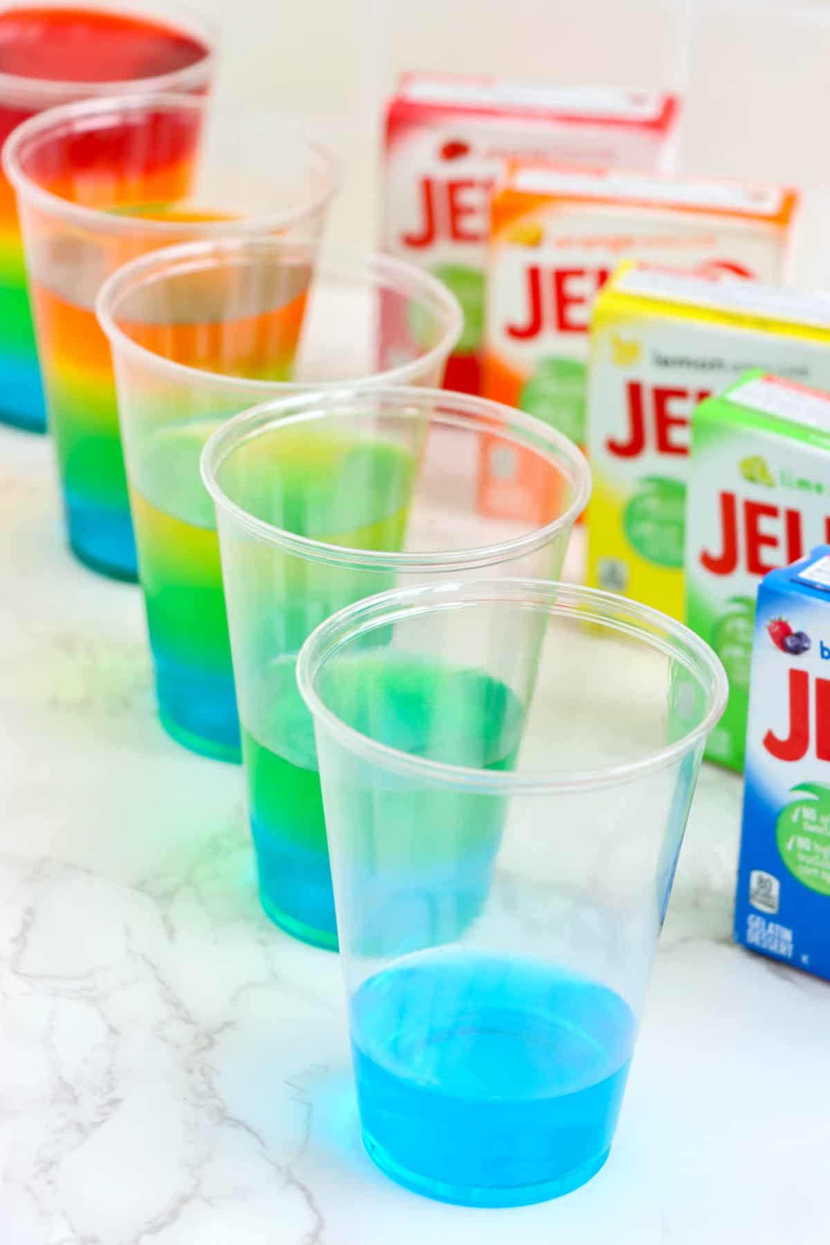 Cool Each Color of jello before pouring the next one on so it doesnt mix.
