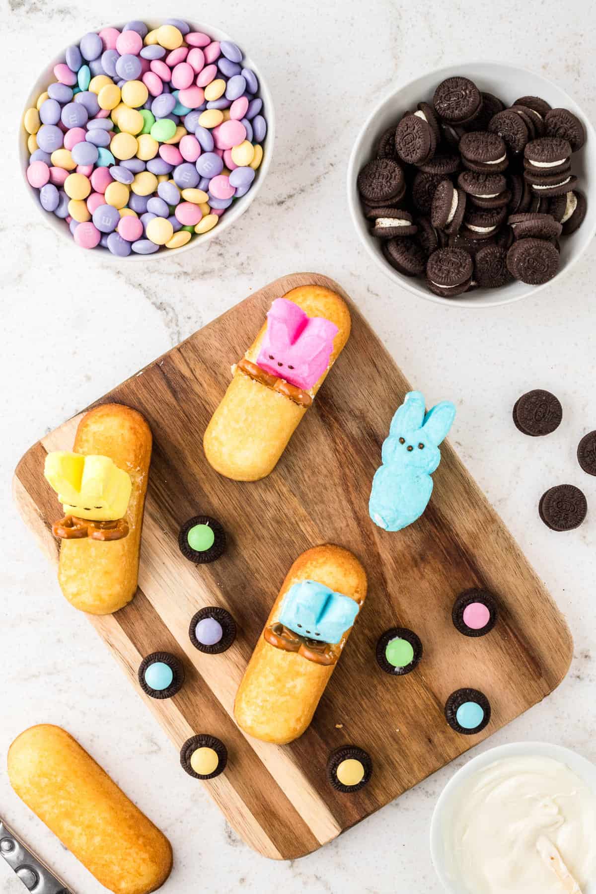 For the wheels, take mini oreos and put a dab of white chocolate on the center of the oreo and add a M&M for the hub of the wheel.