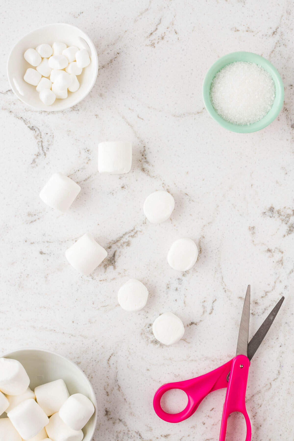 Cut each of the large marshmallows in half.