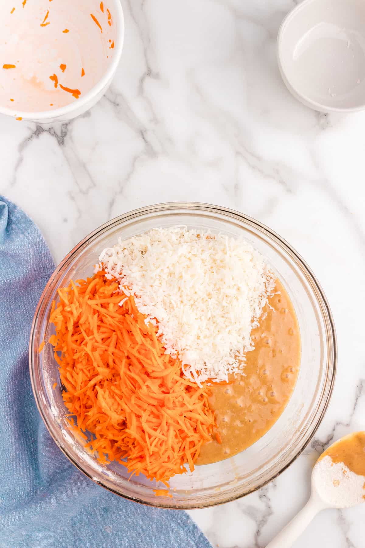 Adding Shredded Carrots and Dry Ingredients to Carrot Cake Batter in Mixing Bowl for Carrot Cake Receipe