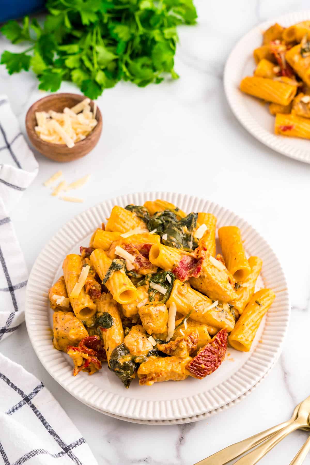 Creamy Tuscan Chicken Pasta on dinner plate ready to enjoy