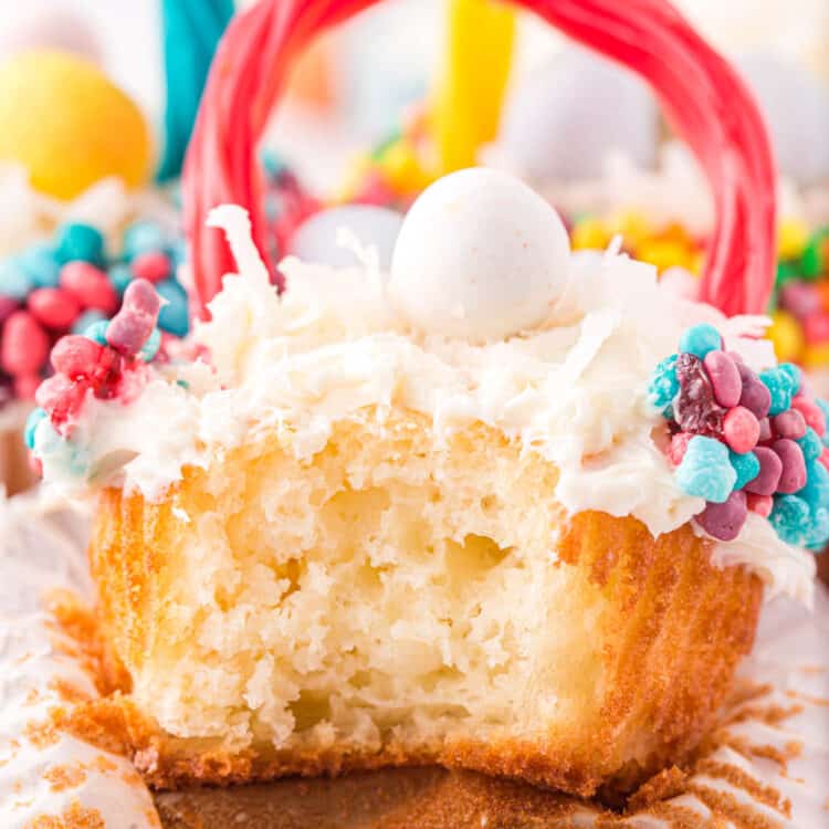 Close up photo of a bite taken out of a cupcake.