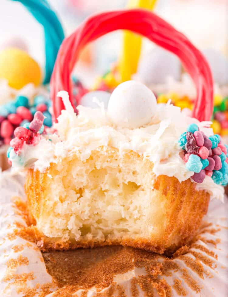 Close up photo of a bite taken out of a cupcake.