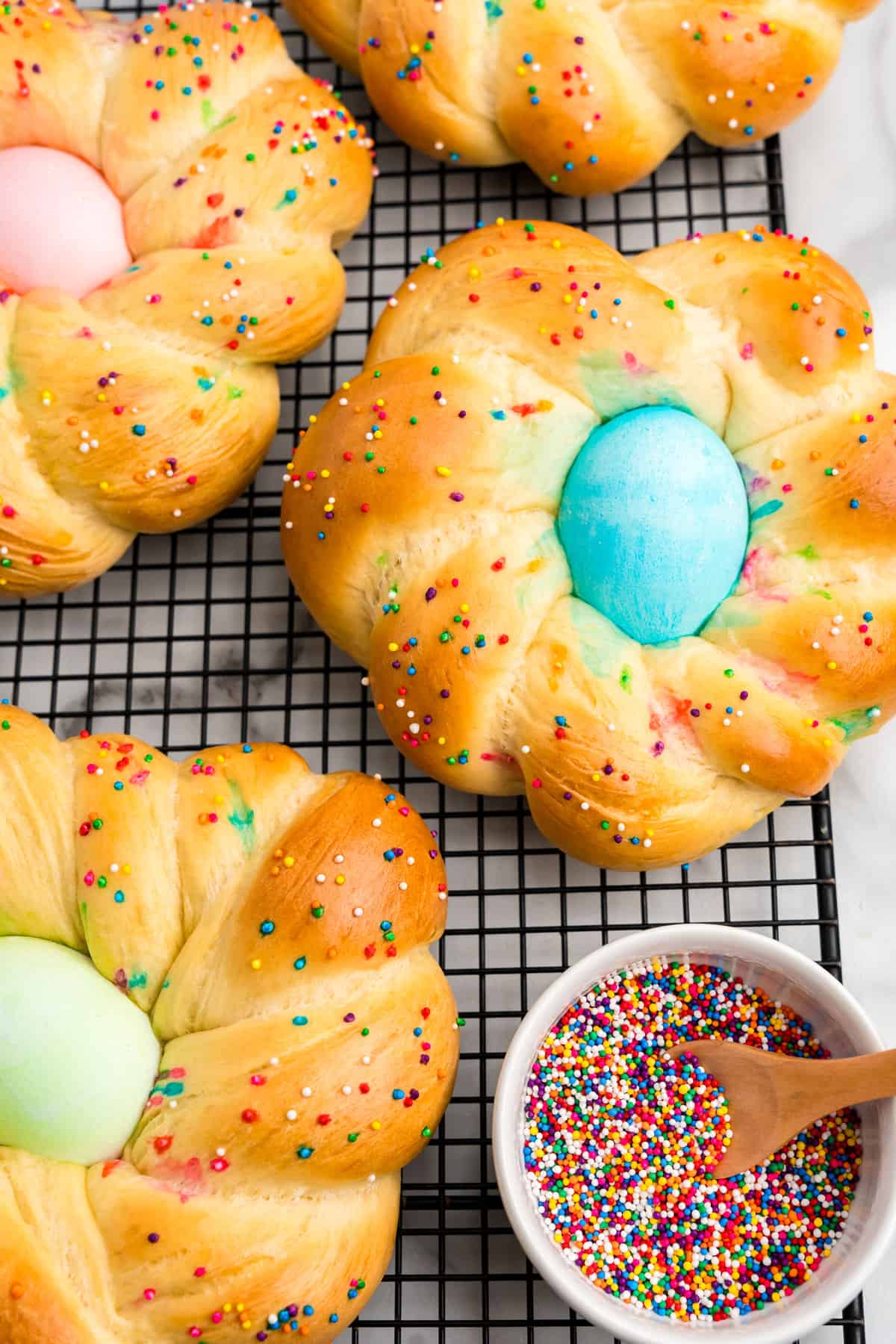 Easter Bread arranged on cooling rack with sprinkles