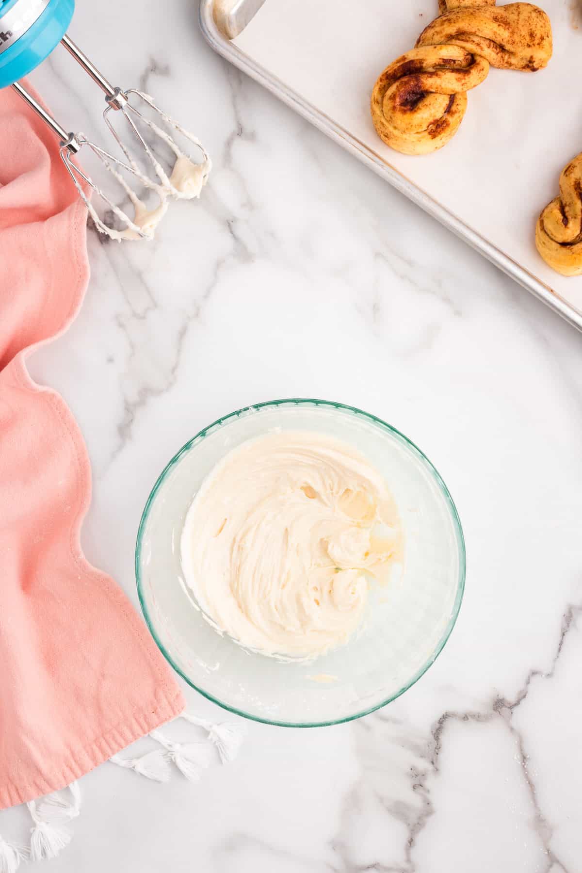 While they are cooling, in a medium mixing bowl add the cream cheese, butter, powdered sugar and vanilla, mix together.