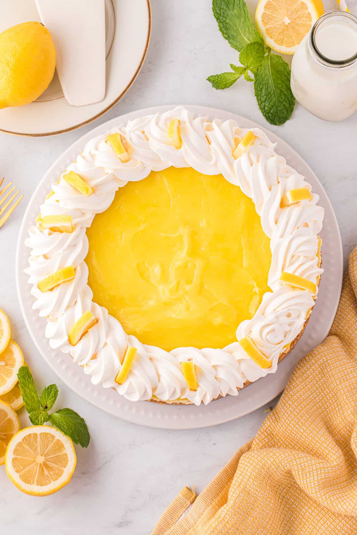 Lemon Cheesecake with Lemon Curd, Whipped Topping, and Fresh Lemon Slices