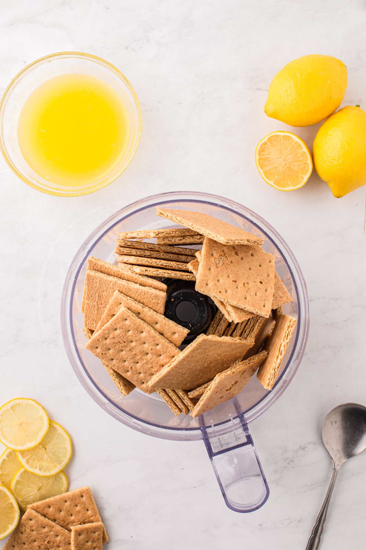 Graham cracker sheets in food processor for Lemon Cheesecake recipe