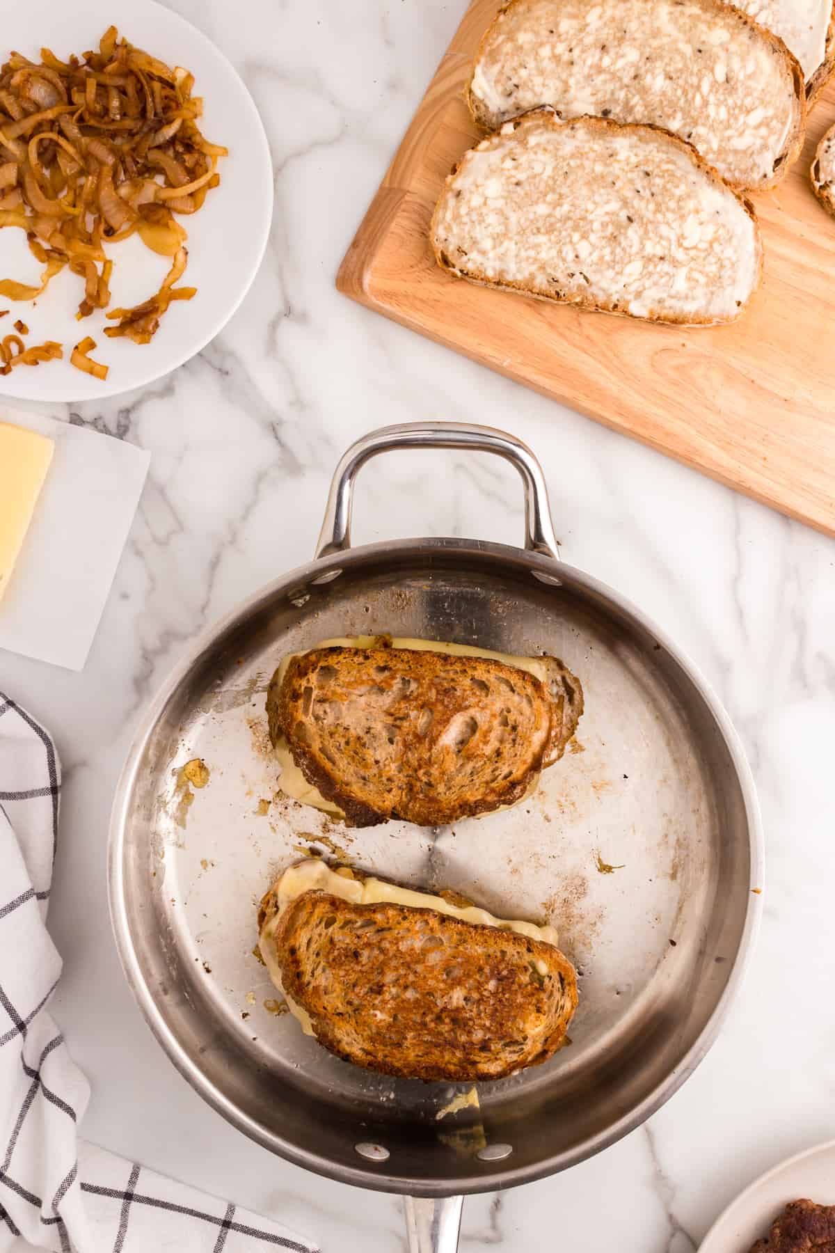 Perfectly browned rye bread loaded with Patty Melt ingredients