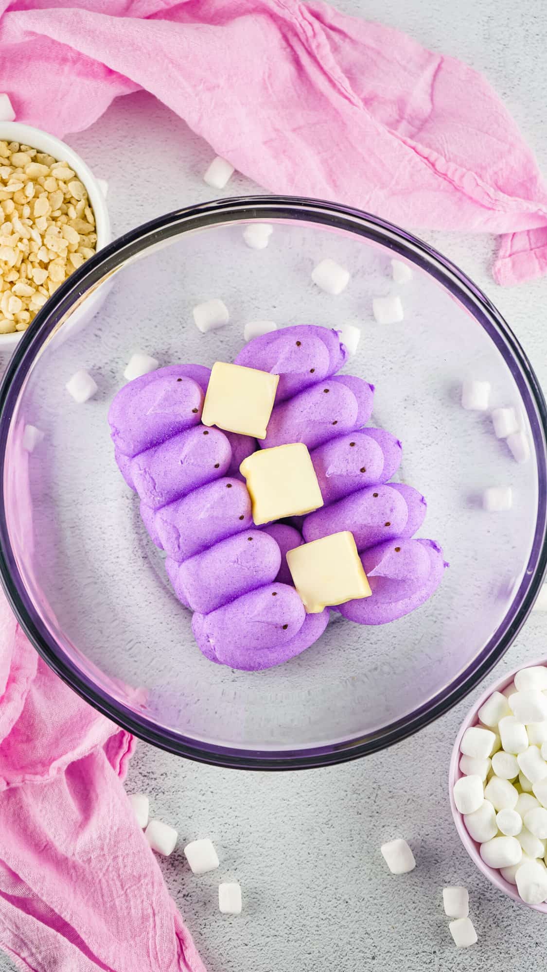 Put each packet of Peeps in separate bowls with butter and mini marshmallows.