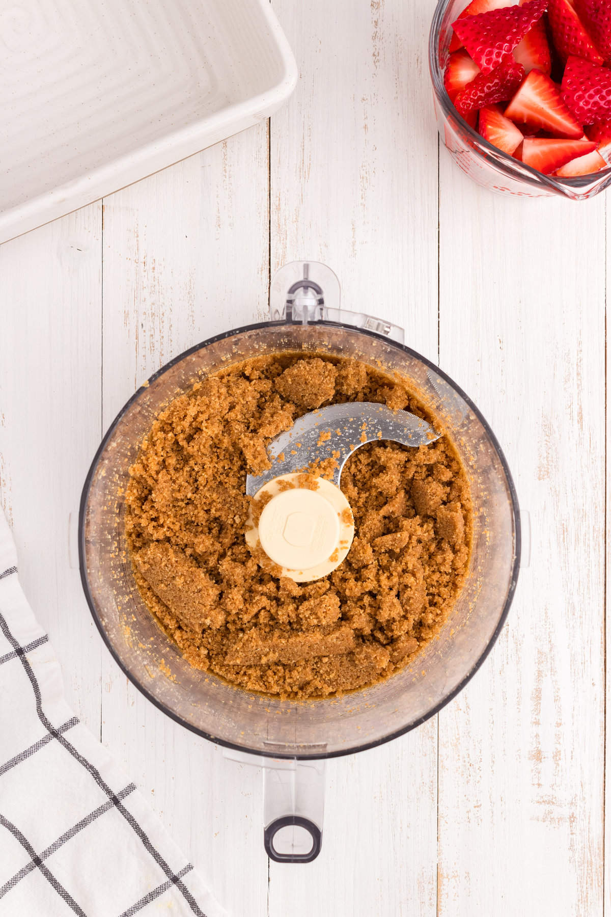 Crust ingredients blended for Strawberry Cheesecake Bars in food processor