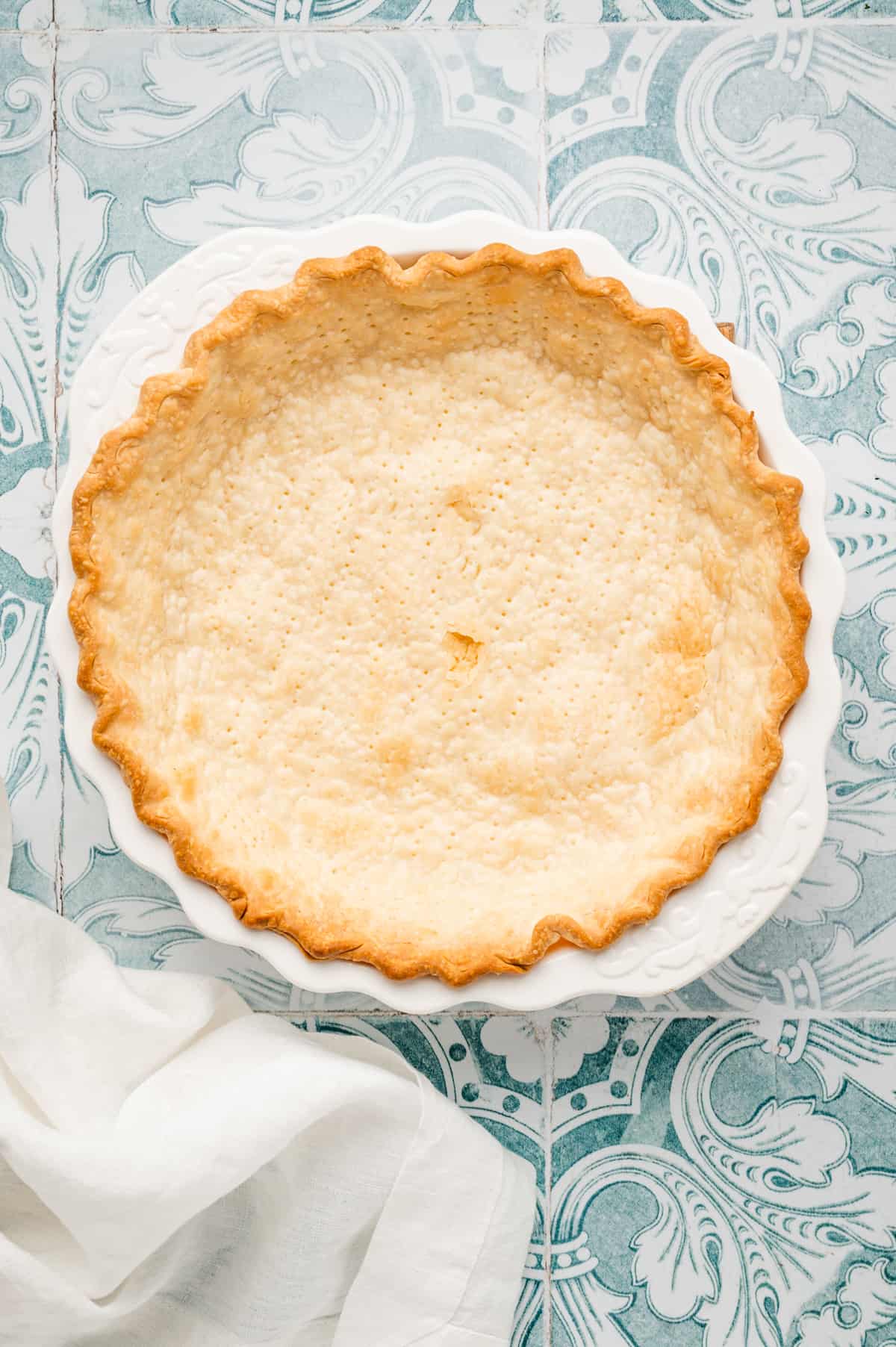Pie crust in pie pan baked to a golden brown for Easy Strawberry Pie