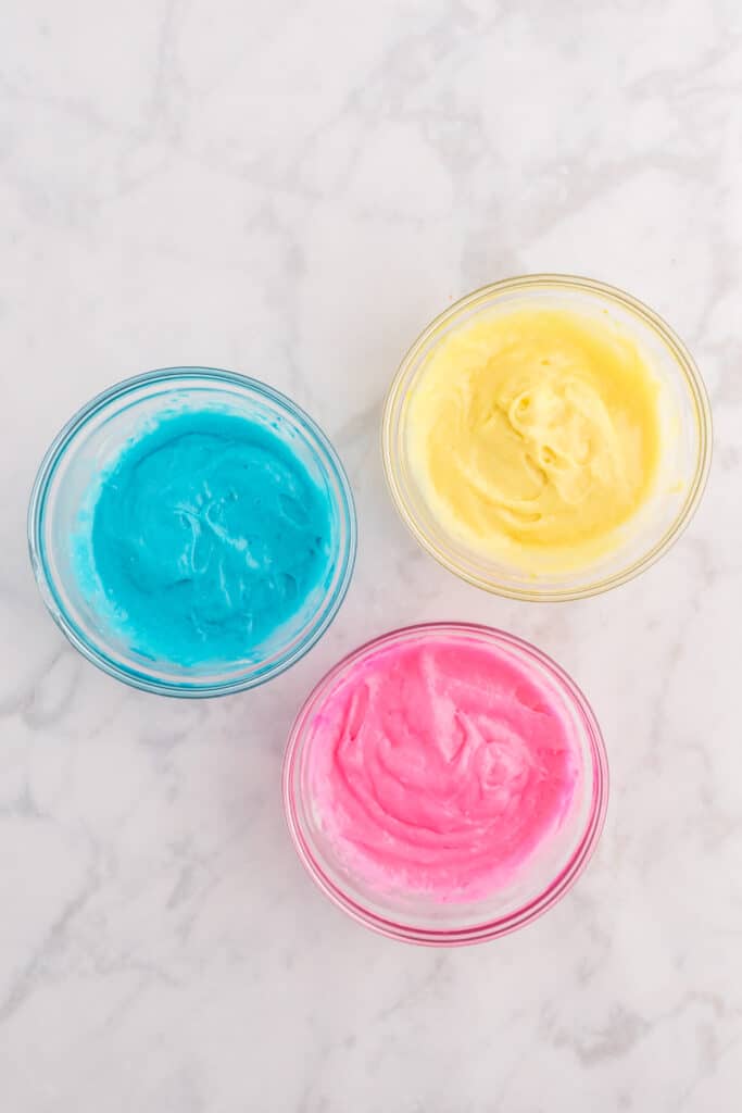 Stir in the food coloring to get 3 different color cake batter bowls.