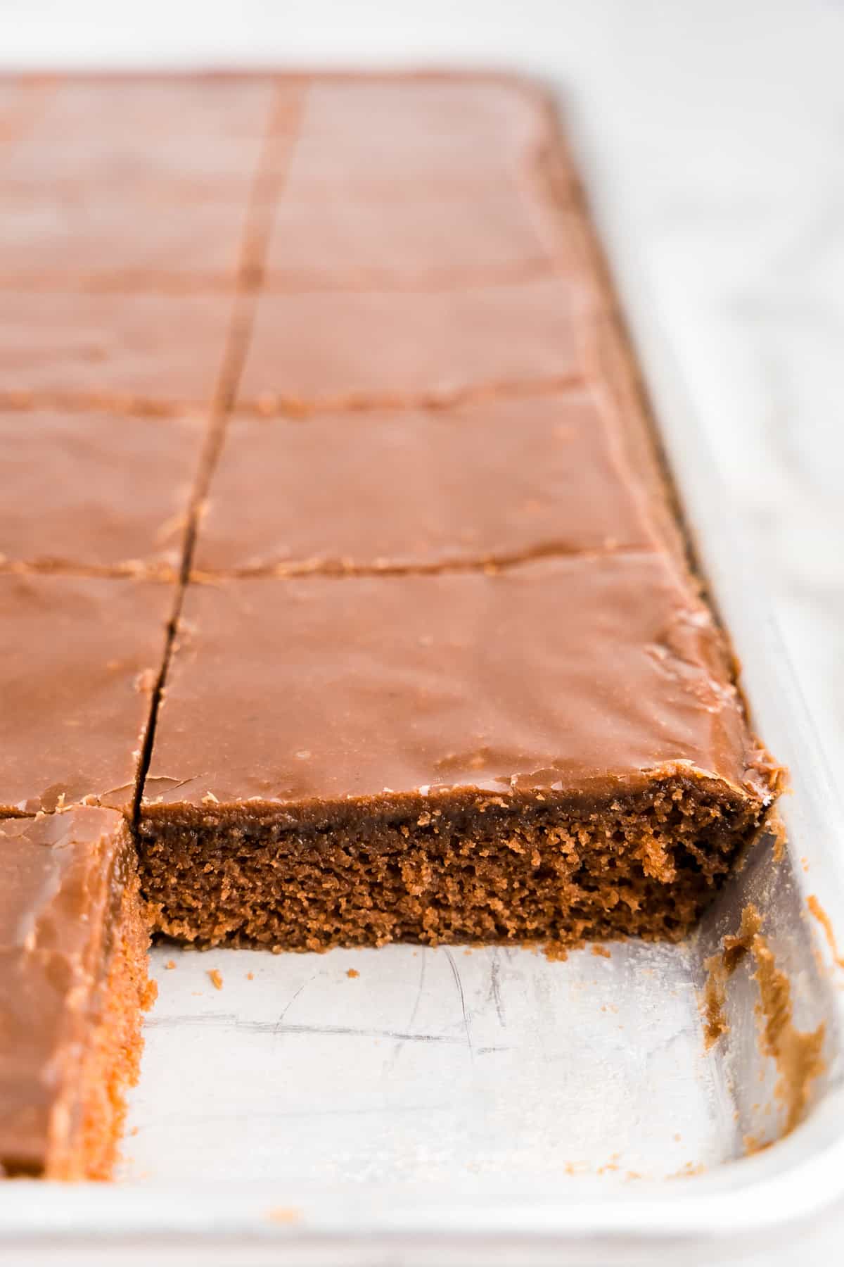 Cutting the Texas Sheet Cake into even squares in the jellyroll pan