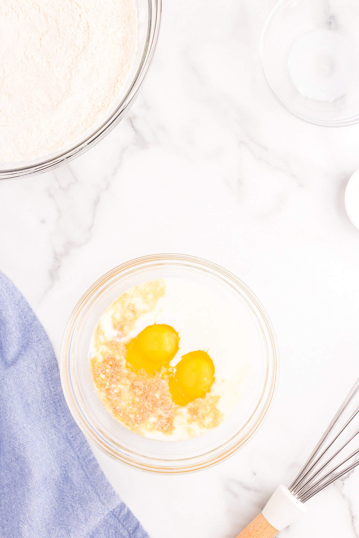 Adding eggs to mixture in bowl for Texas Sheet Cake recipe